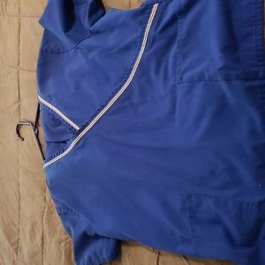 BLUE SCRUB with white stripes across the chest size Large